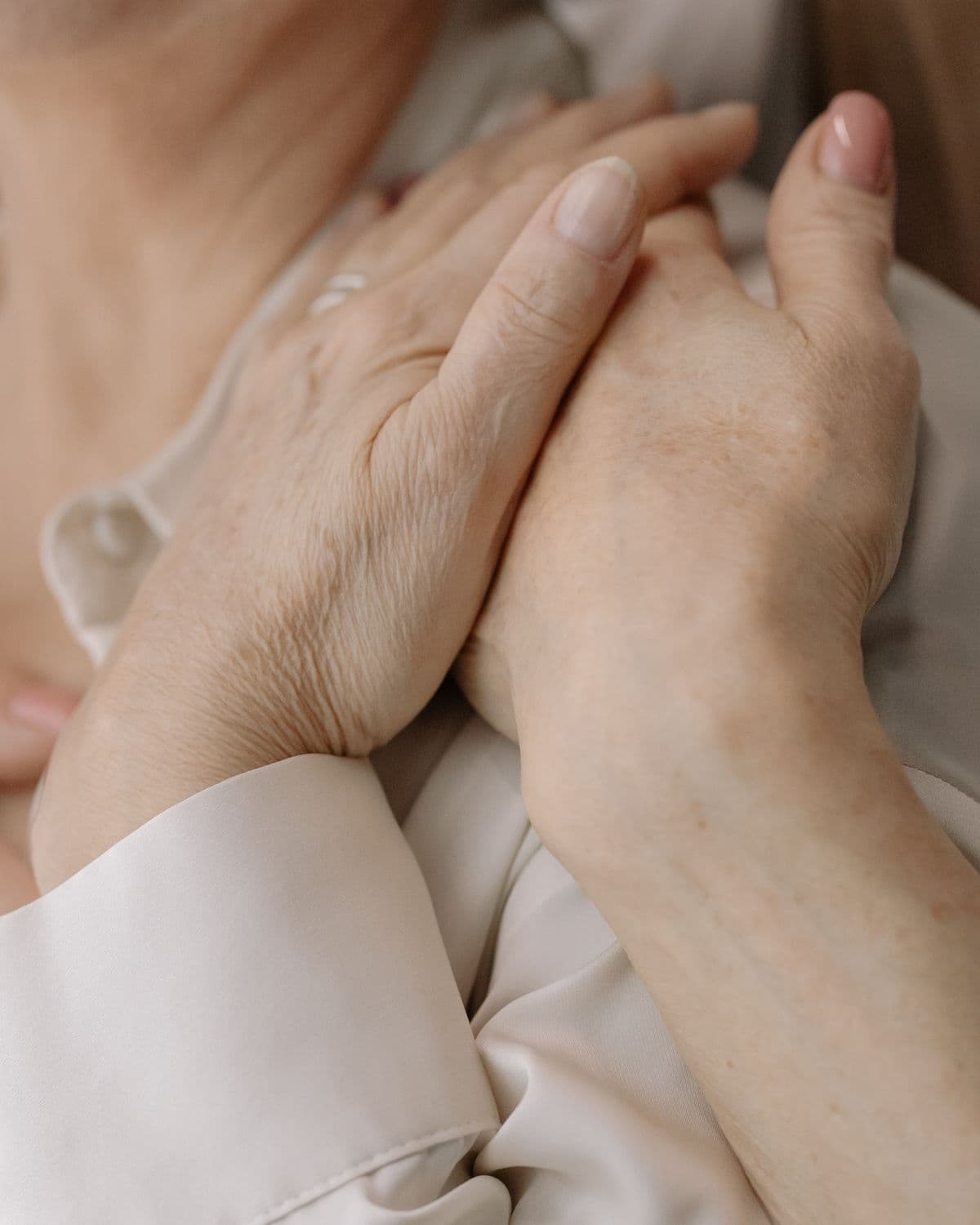 Tender hands offering comfort and dignity
