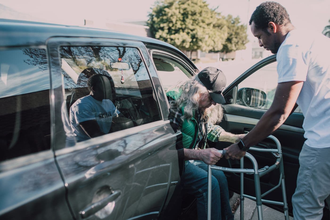 A carer helping a client move safely at home