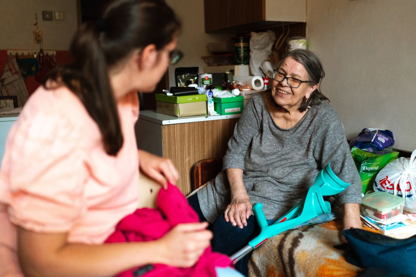 A carer chatting warmly with a client